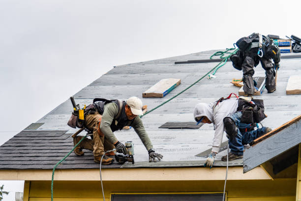 Professional Roofing technician working in Medford, MA